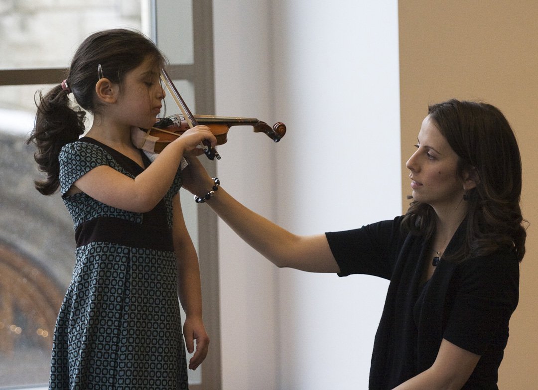 Teacher assisting a student